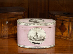Overview of the Georgian Pink Spa Tea Caddy in a decorative collectors setting