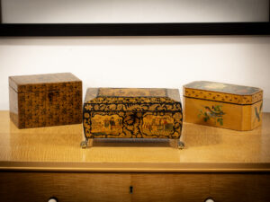 View of the Regency Penwork Sewing Box in a decorative setting