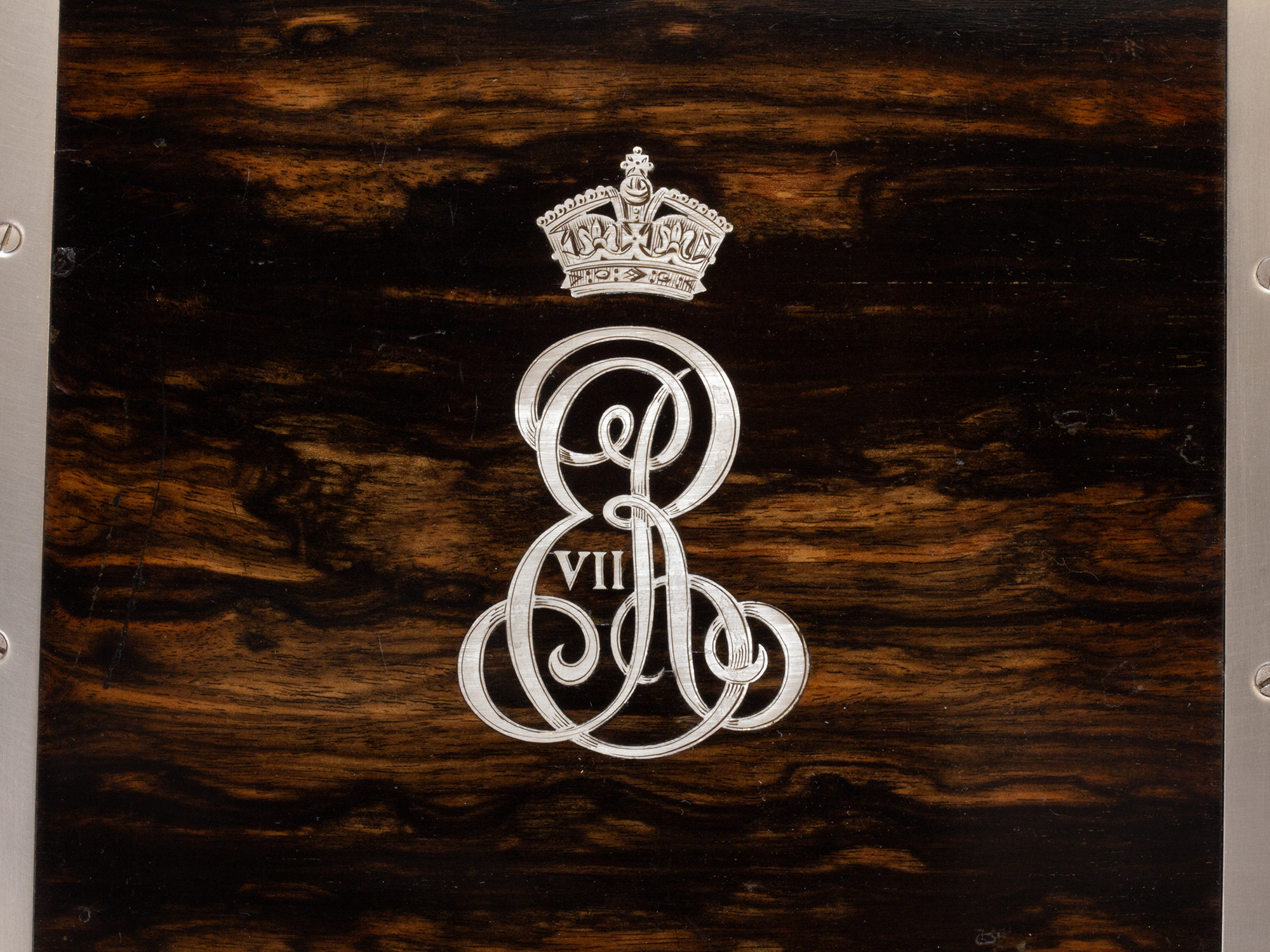 Close up of the royal cypher of the King Edward VII Coromandel Games Compendium by Betjemann & Sons
