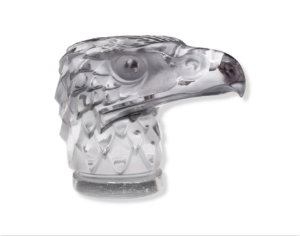 It is our pleasure to present a stunning creation of Rene Lalique’s – Model number #1138, a Magnificent Eagle Car Mascot. Presented in a luxurious clear finish with a mild amethyst tint, this René Lalique "Tete D'Aigle" Mascot is a work of art. Inscribed above the base is the following mark: "R Lalique" “Tete D'Aigle”, also known as “Eagle Head”