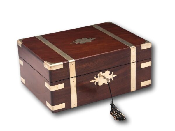 Solid mahogany jewellery box with the key inserted