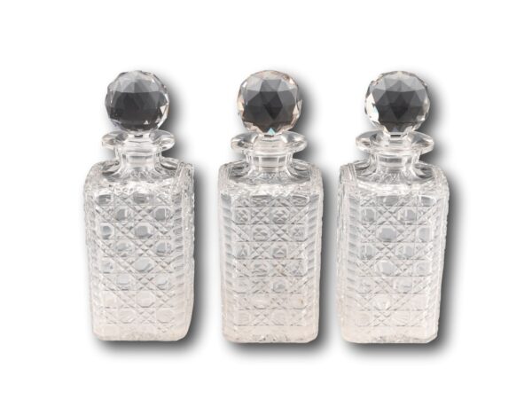 View of the three hand cut hobnail decanters