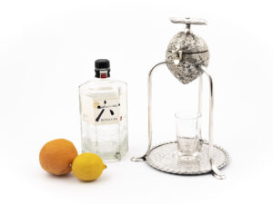 Hukin & Heath Fruit Squeezer with gin bottle and fruit