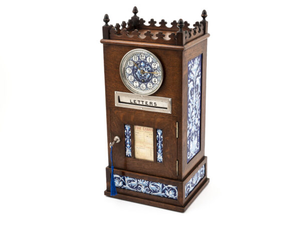 Overview of the Aesthetic Movement Letter Box Clock with the key inserted