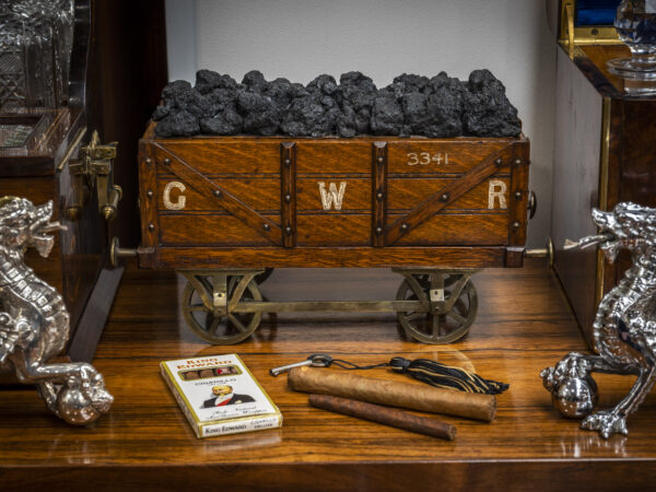 Antique coal wagon humidor on a table
