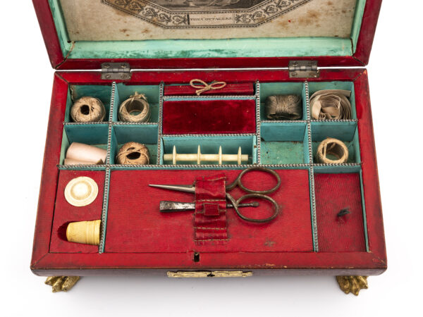 antique red leather sewing box contents close up