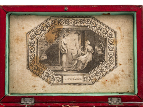 antique red leather sewing box print close up