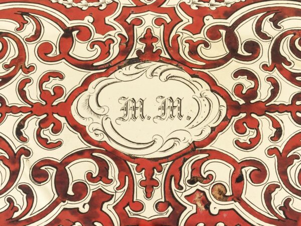 Close up of the initial monogram plate