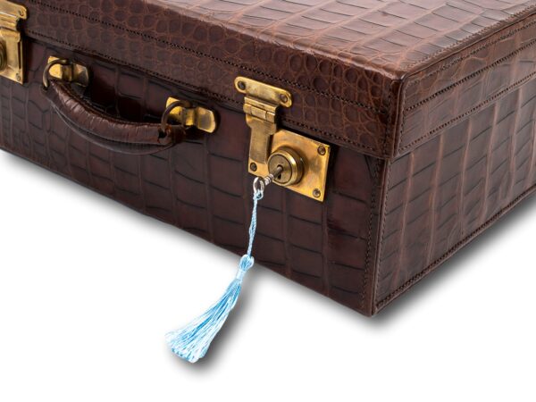 Close up of the Art Deco Crocodile Luggage Case with the key inserted