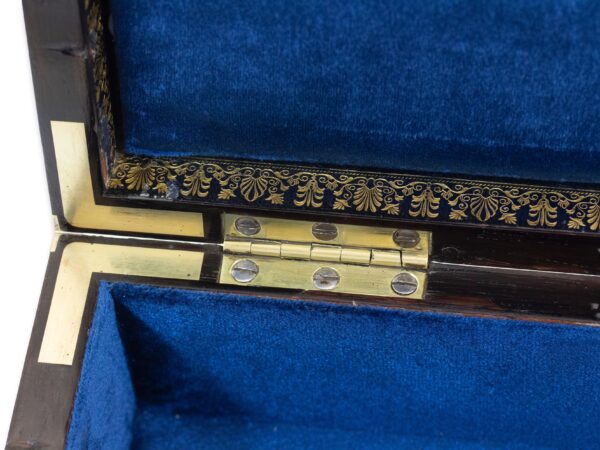 Close up of the good quality hinges and brass inlay
