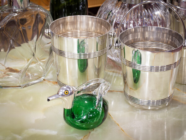 Sterling Silver & Green Glass Duck Decanter in a decorative collectors setting