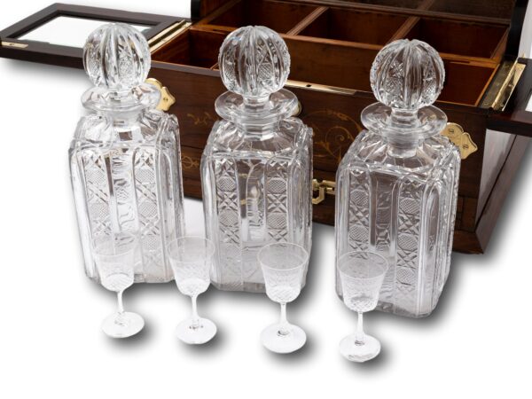 View of the three large glass decanters with four spirit glasses