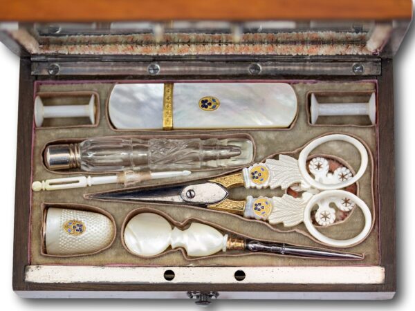 Close up of the mother of pearl tools with gold mounts and pansy decoration