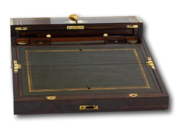 Rosewood writing box opened showing the green leather writing slope