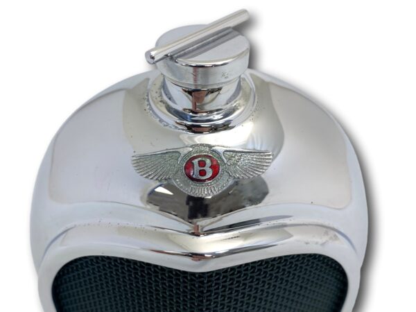 Close up of the Ruddspeed Bentley Radiator Decanter enamel badge and radiator cap
