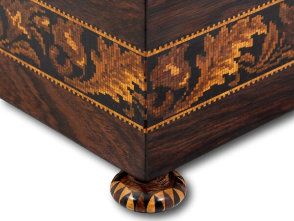 Close up of the inlaid feet on the Tunbridge Ware Sewing Box