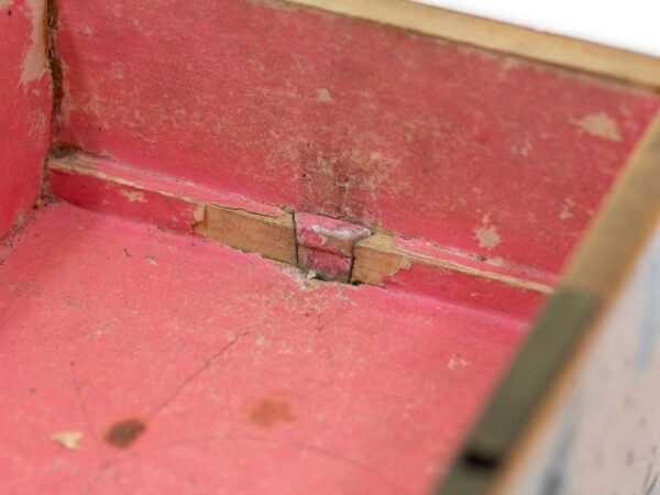 Close up of the interior showing the wedge peg for the lower drawer