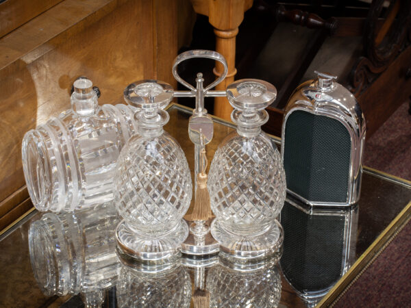 Overview of the Hukin & Heath Decanter Tantalus Set in a collectors setting