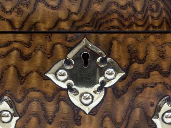 Close up of the scrollwork brass escutcheon