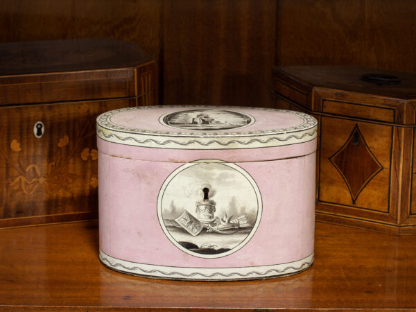 Overview of the Georgian Pink Spa Tea Caddy in a decorative collectors setting