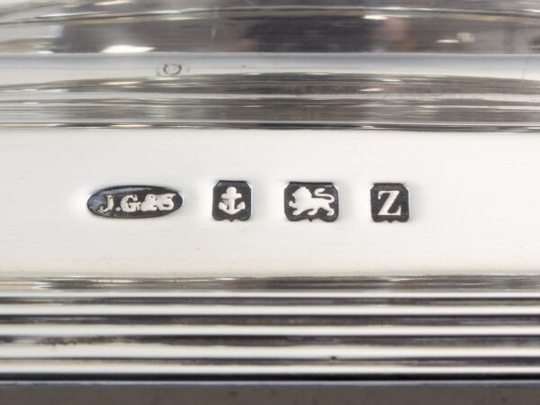 Close up of the John Grinsell & Sons birmingham silver hallmark