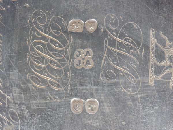 Close up of the hallmarks on the base of the caddies