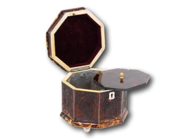Overview of the regency octagonal tortoiseshell tea caddy with the lid up and caddy lid removed
