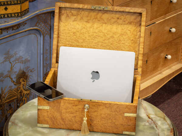 Overview of the Birdseye Maple Jewellery Box in a decorative setting with a laptop and phone placed inside