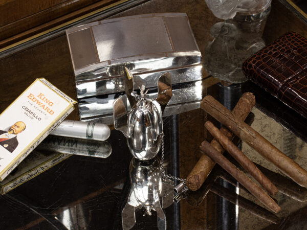 Overview of the Novelty Torpedo Table Lighter in a collectors decorative setting