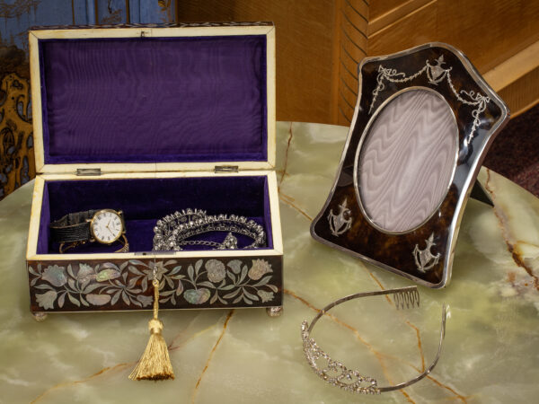 Overview of the Regency Tortoiseshell and Mother of Pearl Jewellery Box in a decorative collectors setting
