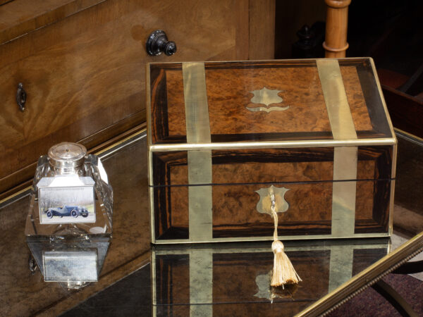 Overview of the Antique Victorian Walnut & Coromandel Jewellery Box in a decorative collectors setting