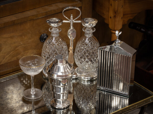 Overview of the stepped art deco cocktail shaker in a decorative collectors setting