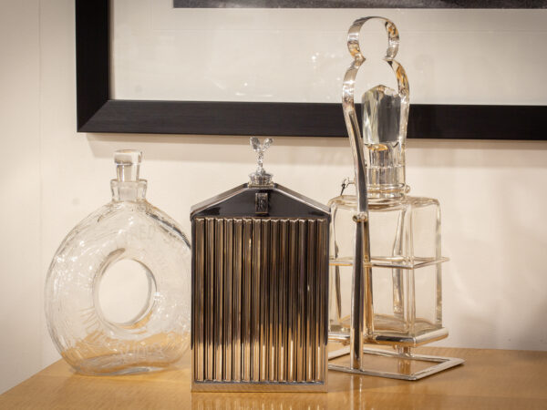 Classic stable Rolls Royce decanter in a decorative collectors setting