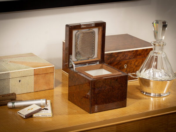Front overview of the Dunhill Humidor with the lid up in a decorative setting