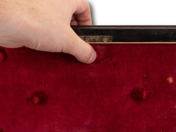 View of the secret latch button behind the lining