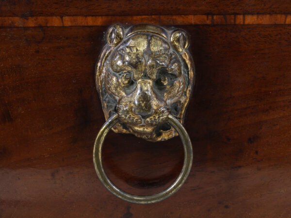 Close up of the lion mask handle on the Regency Tea Chest with Hidden Spoon Compartment