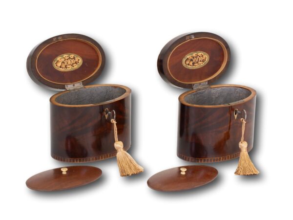 Front overview of the Georgian Pair of Mahogany Tea Caddies with the keys inserted lids up showing the floating lids
