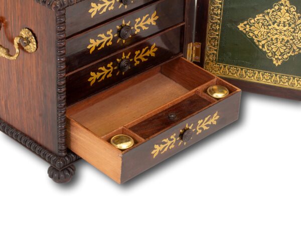 Close up of the bottom drawer with inkwells and storage