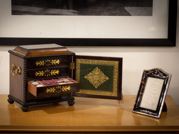 Overview of the Rosewood Sewing Cabinet in a decorative collectors setting