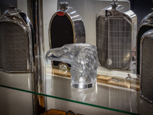 René Lalique Tete D’Aigle Car Mascot in a decorative collectors setting