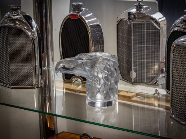 René Lalique Tete D’Aigle Car Mascot in a decorative collectors setting