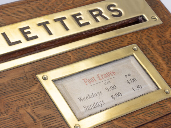 Close up of the Letters and post leaves brass plaques