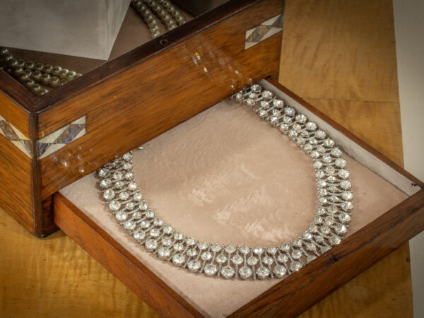 Close up of the jewellery tray with a necklace for decorative and scale visual