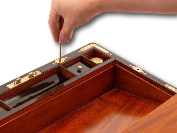 View of the locking pin in position to release the secret compartment