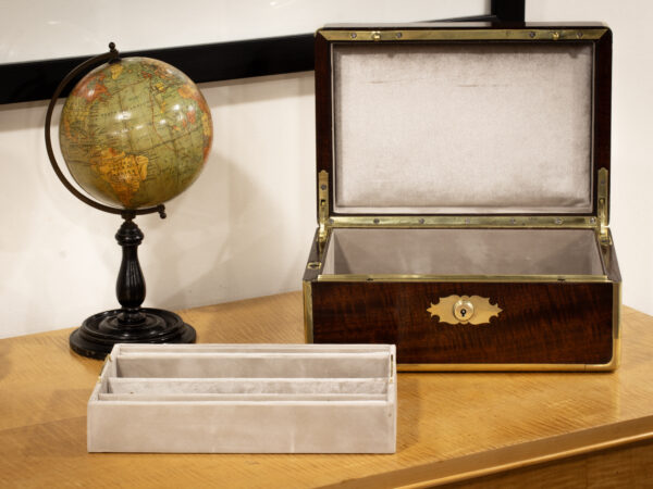 Decorative lifestyle image of the interior of the Antique Mahogany Jewellery Watch Box