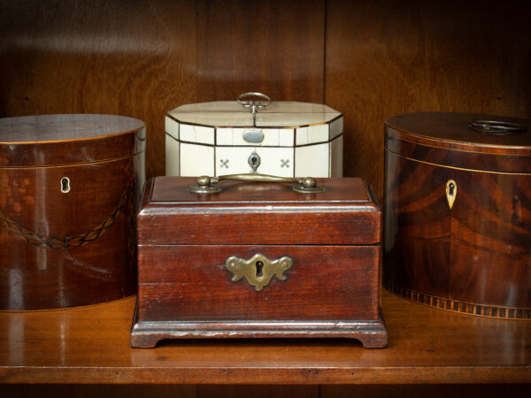 Lifestyle shot of the Miniature Mahogany Tea Caddy with the lid up