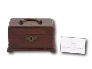Front of the Miniature Mahogany Tea Caddy next to a standard business card for scale