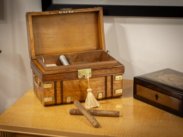 Overview of the Novelty Oak Cigar Trunk Humidor in a decorative setting