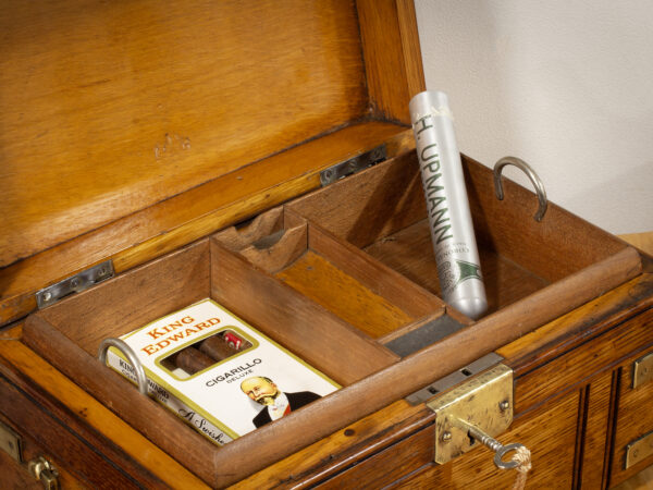 Close up of the Novelty Oak Cigar Trunk Humidor in a decorative setting