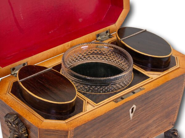 Close up of the tea caddies and glass sugar bowl